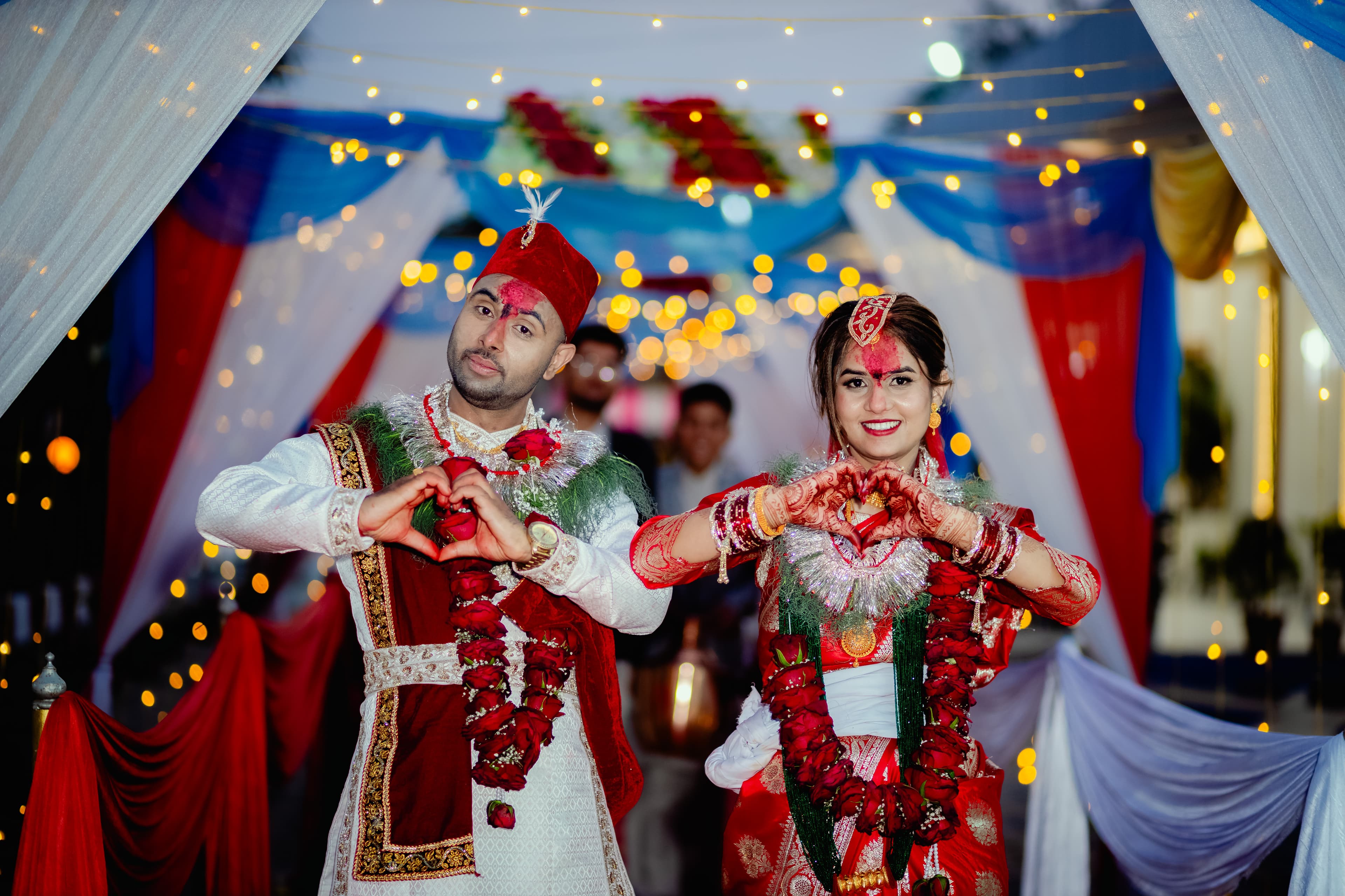 Couple Heart Pose with Fairy Lights